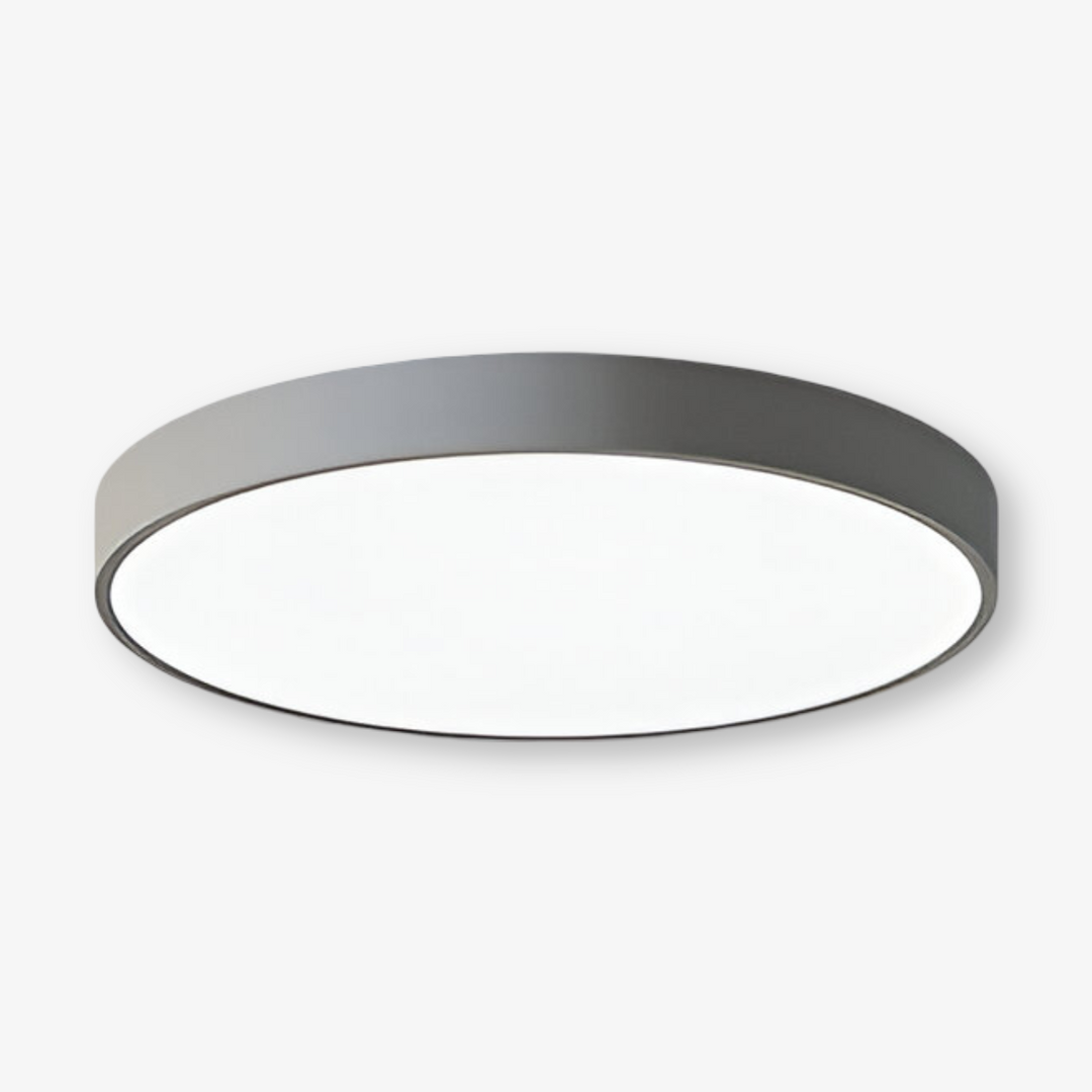 Elegant, tunn, rund LED taklampa i modern design. Perfekt takmonterad belysning för hemmet.