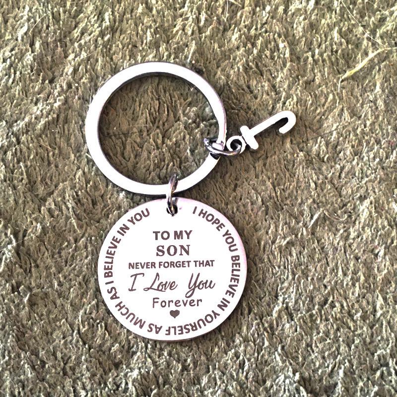 "Rund nyckelring för son/dotter i rostfritt stål, symboliserar kärlek och omsorg, perfekt accessoar och meningsfull gåva."