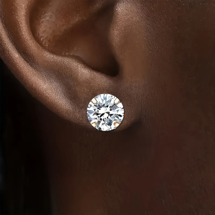 Eleganta unisex örhängen med glänsande zirkonia, tillverkade i titanstål. Klassiska och stilrena smycken.