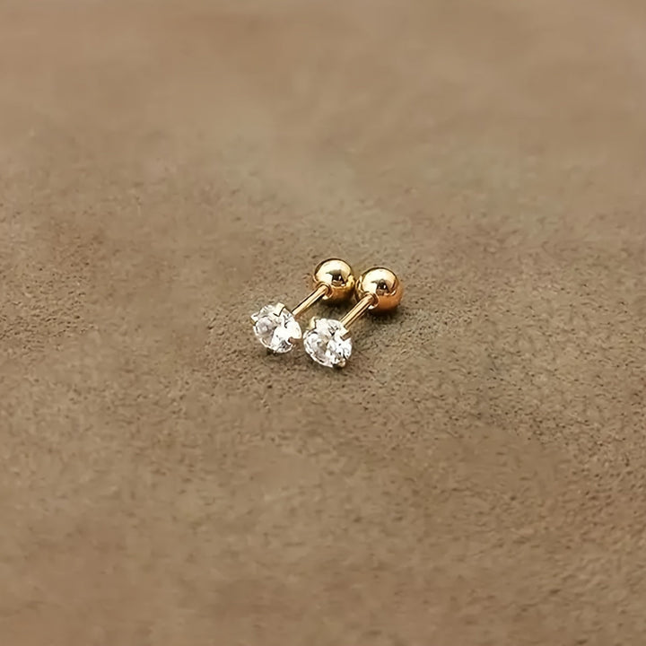 Lätta runda unisex örhängen i titanstål med en enkel zirkonia sten. Glänsande klassiska accessoarer.