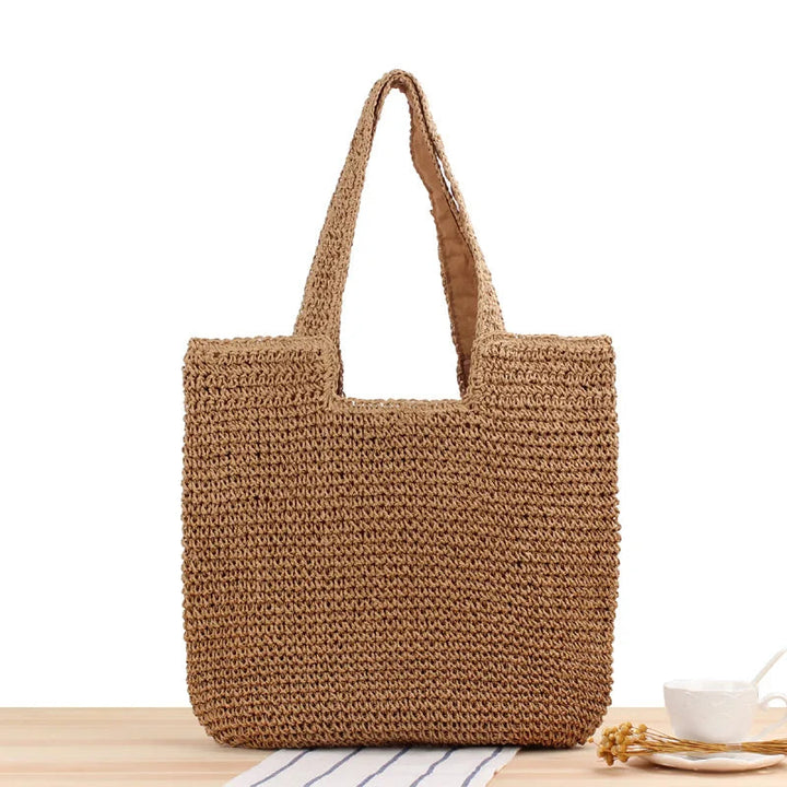 Sommarinspirerad brun och beige toteväska, perfekt som axelväska för stranden.