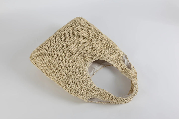 Rymlig beige dam toteväska, en trendig handväska som passar alla årstider.