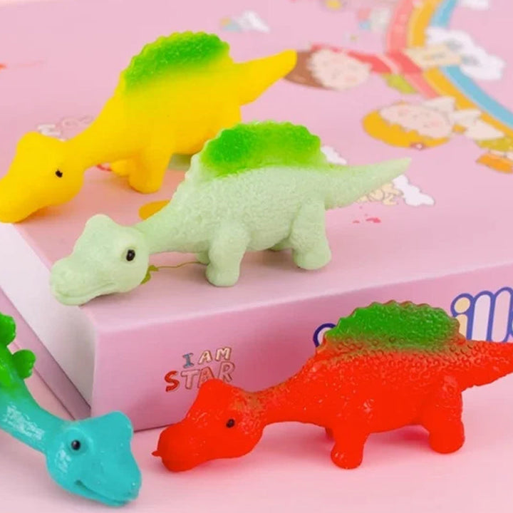 "Set om 10 fingerleksaker med dinosaurieslungor i färgglada mönster, perfekt för barn att leka och lära sig om dinosaurier."