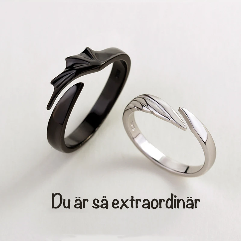 Ängel och Demon Parring i silver för män och kvinnor, elegant kontrast mellan svart och vitt, symbol för tidlös kärlek.