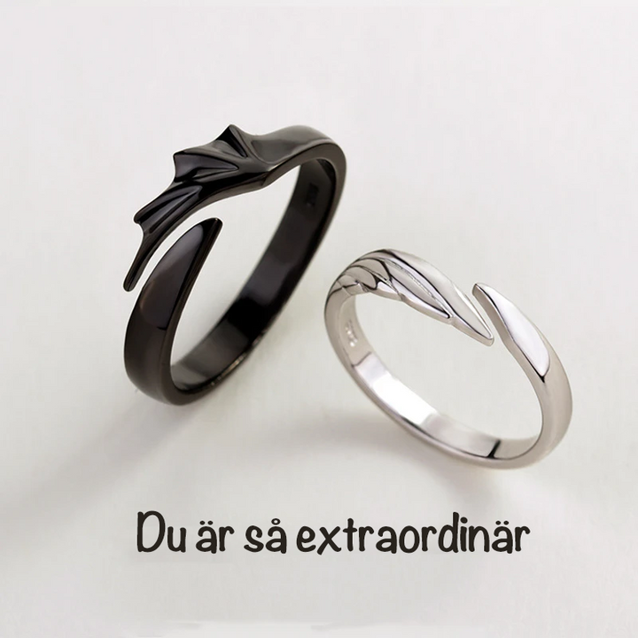 Ängel och Demon Parring i silver för män och kvinnor, elegant kontrast mellan svart och vitt, symbol för tidlös kärlek.
