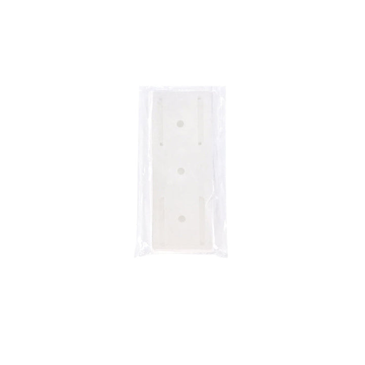 "Självhäftande stansfri sockelhållare, vit, universell för olika ytor, ingen skada vid montering, minimalistisk design."