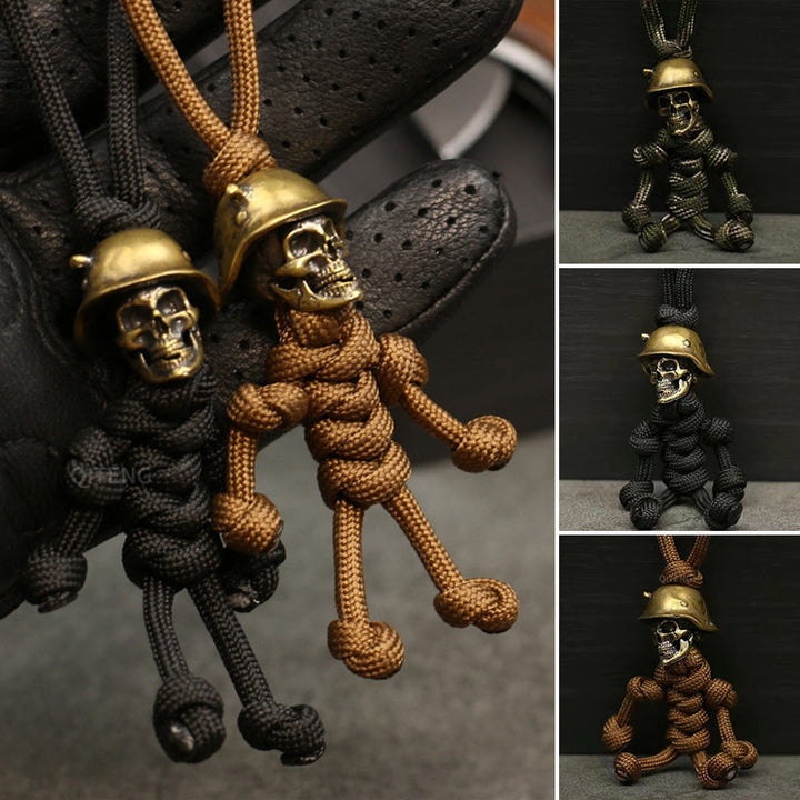 "Skelet soldat nyckelring i koppar och paracord, robust design med slitstark tygfläta och unik kopparlook."