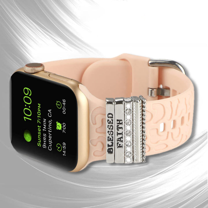 Smartklockband med dekorativa metallringar i gyllene leopardmönster och roséguldstjärnor, elegant stilaccessoar.