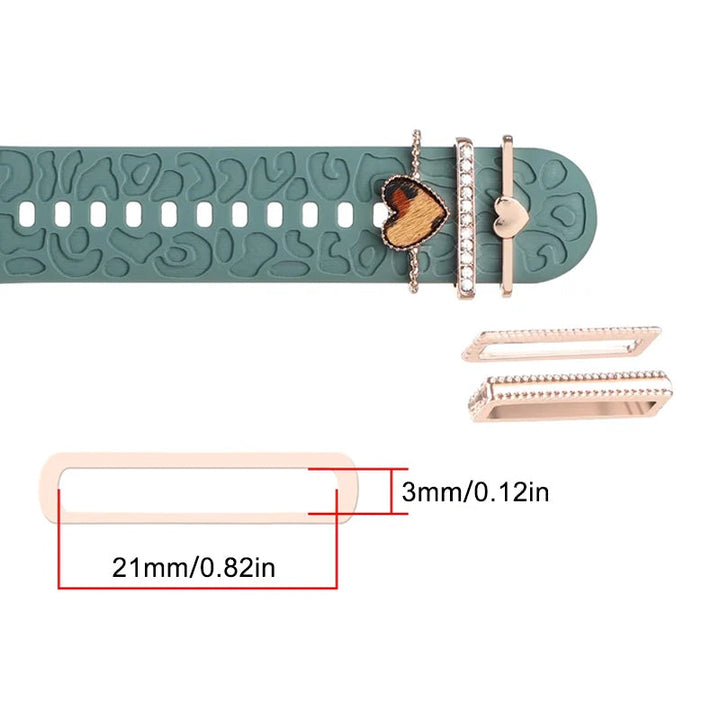 Smartklockband med dekorativa metallringar i gyllene leopardmönster och roséguldstjärnor, elegant stilaccessoar.