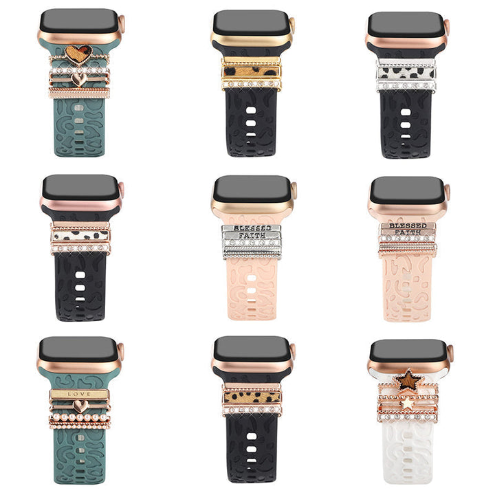 Smartklockband med dekorativa metallringar i gyllene leopardmönster och roséguldstjärnor, elegant stilaccessoar.