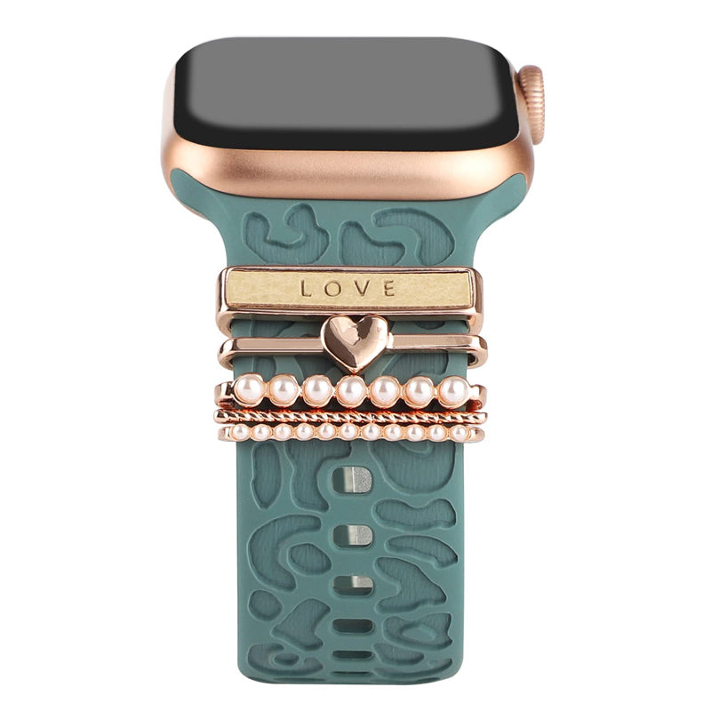 Smartklockband med dekorativa metallringar i gyllene leopardmönster och roséguldstjärnor, elegant stilaccessoar.