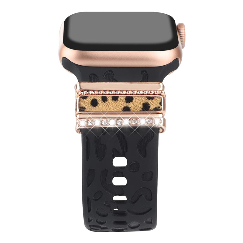 Smartklockband med dekorativa metallringar i gyllene leopardmönster och roséguldstjärnor, elegant stilaccessoar.