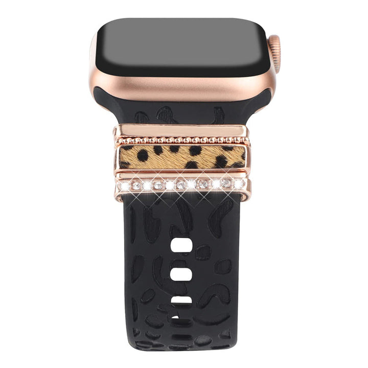 Smartklockband med dekorativa metallringar i gyllene leopardmönster och roséguldstjärnor, elegant stilaccessoar.
