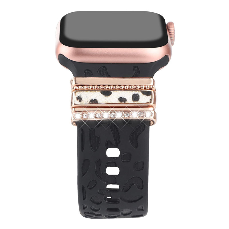 Smartklockband med dekorativa metallringar i gyllene leopardmönster och roséguldstjärnor, elegant stilaccessoar.