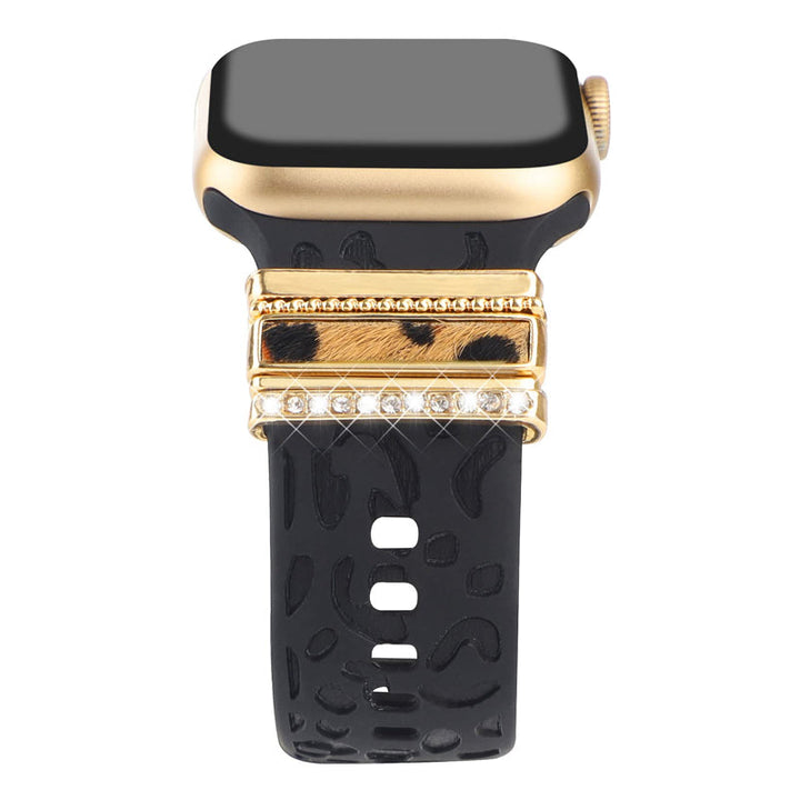 Smartklockband med dekorativa metallringar i gyllene leopardmönster och roséguldstjärnor, elegant stilaccessoar.