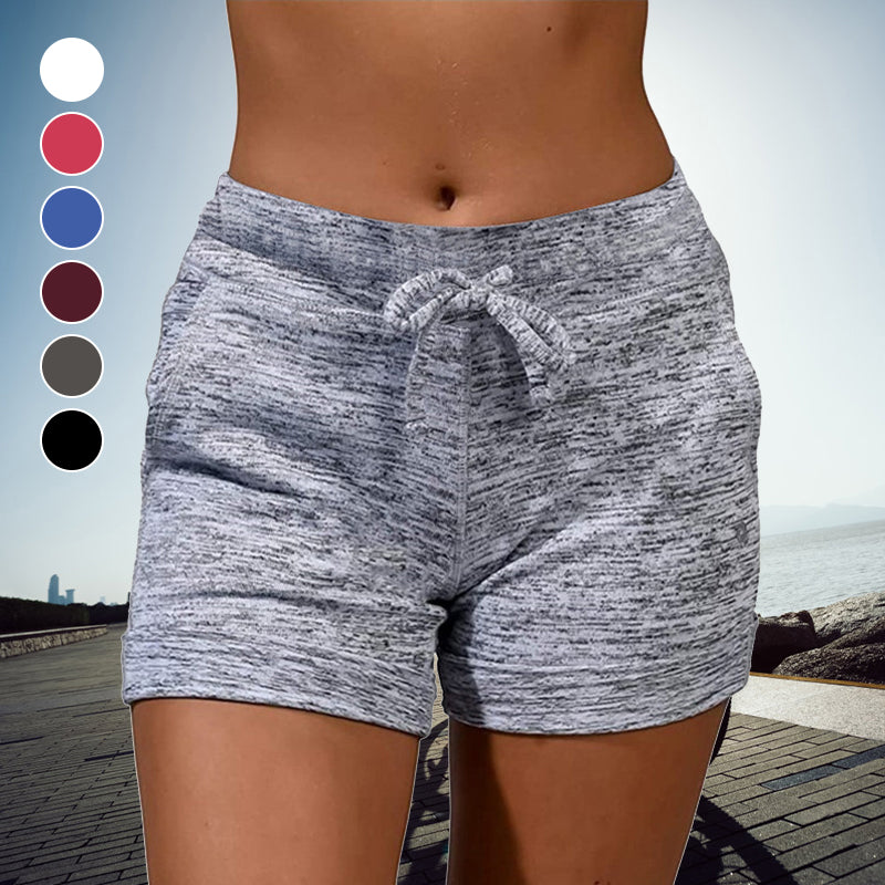 Snabbtorkande damshorts med mini-längd, elastisk midja och två fickor, perfekt för sommarmode och aktiviteter.