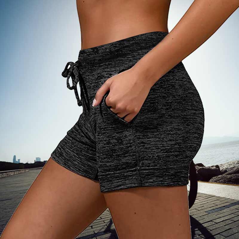 Snabbtorkande damshorts med mini-längd, elastisk midja och två fickor, perfekt för sommarmode och aktiviteter.