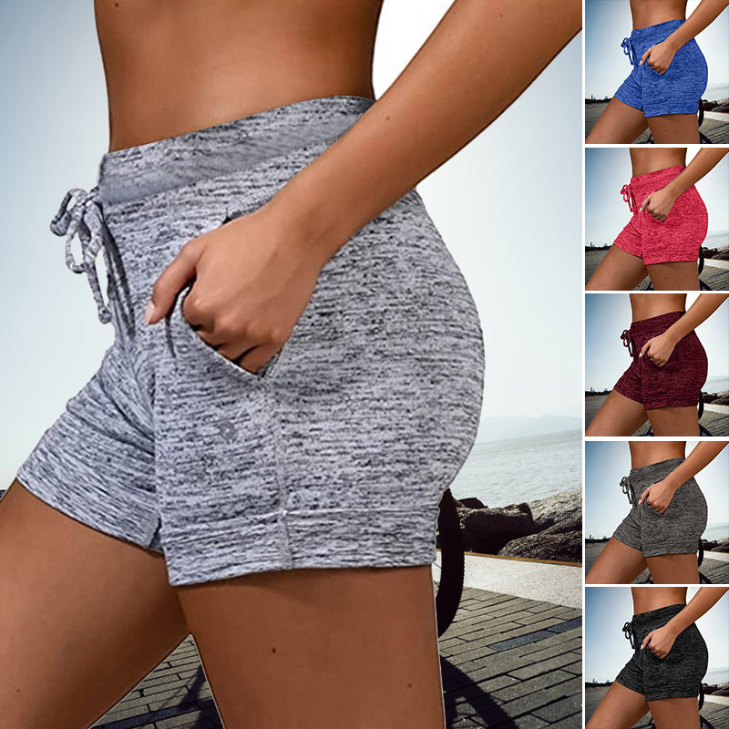 Snabbtorkande damshorts med mini-längd, elastisk midja och två fickor, perfekt för sommarmode och aktiviteter.