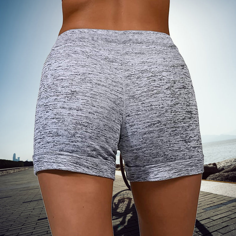 Snabbtorkande damshorts med mini-längd, elastisk midja och två fickor, perfekt för sommarmode och aktiviteter.