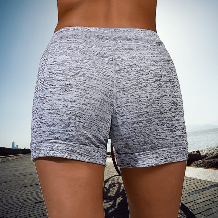 Snabbtorkande damshorts med mini-längd, elastisk midja och två fickor, perfekt för sommarmode och aktiviteter.
