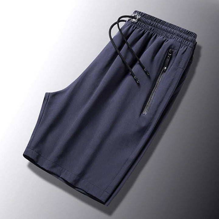 "Snabbtorkande herrshorts för stranden med sportlinjeformad design, fantastisk elasticitet och ventilerande material."