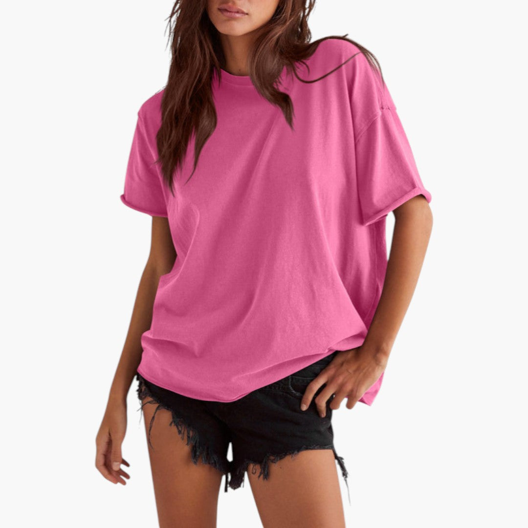 Snygg dam T-shirt med rund hals och avslappnade ärmar i bekväm, kortärmad design för sommar och vardag.
