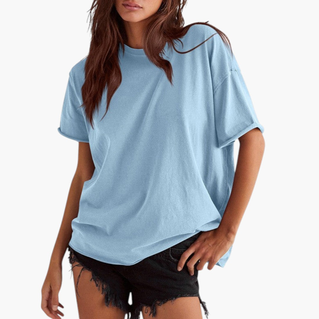 Stilren dam T-shirt med rund hals, kort ärm och avslappnad silhuett. Idealisk för en avslappnad stil.