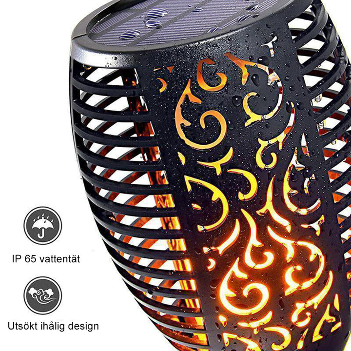 Solcellsdriven LED-bordslampa med flammande ljus, skimrar som naturliga eldflammor; perfekt för atmosfärisk utomhusbelysning.