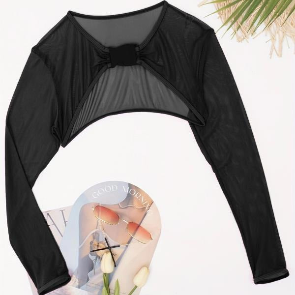 Sportig cropped långärmad damtopp med elegant spänne, perfekt för träning och fritid.