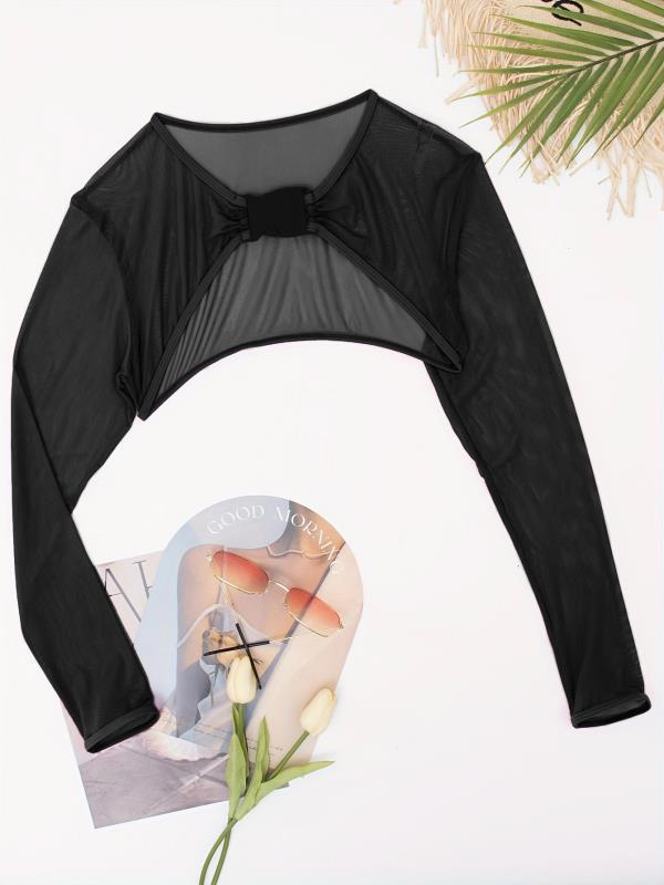 Bekväm cropped långärmad damtopp med spänne. Idealisk för flexibel träning och fritid.