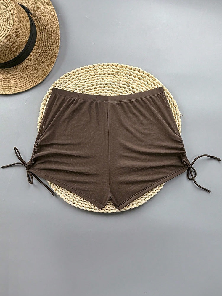 Sportiga damshorts med justerbara sidor, perfekta badkläder för sommarens äventyr och vattenaktiviteter.