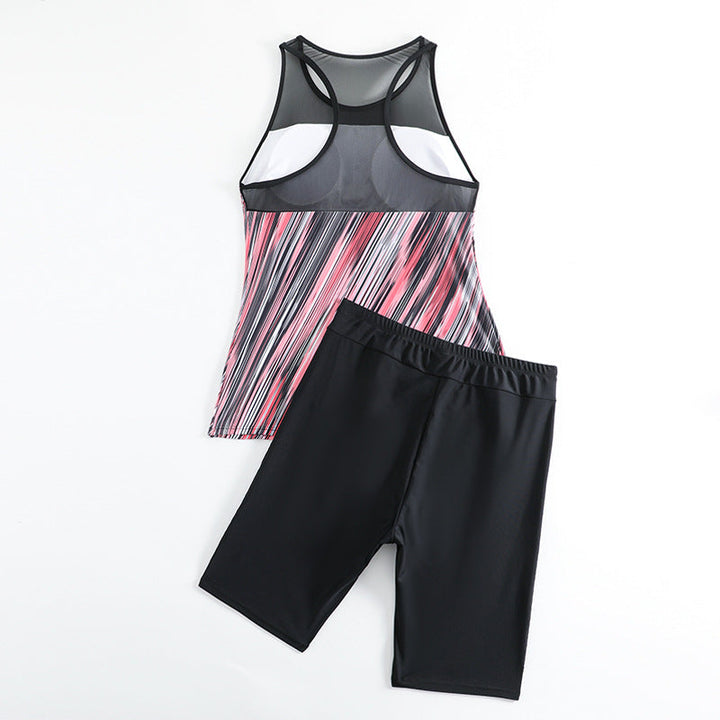 Elegant och bekvämt dam tankini-set i sportig stil med mönstrad topp och enfärgade shorts för soliga dagar.