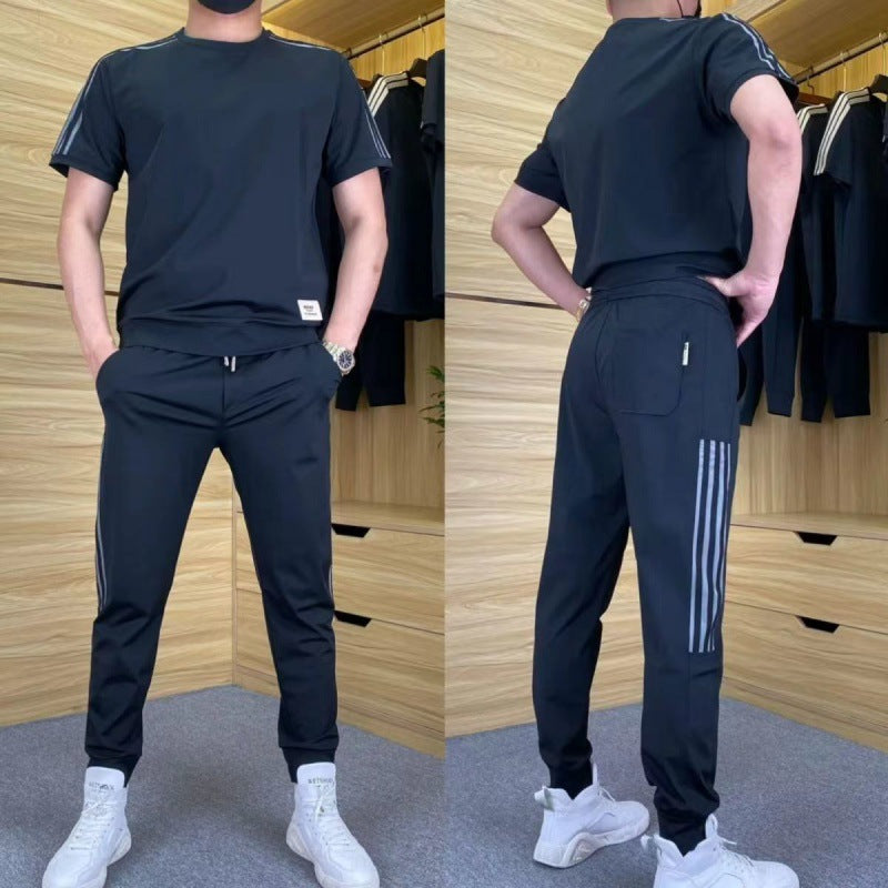 Svart stretchigt herrset framifrån och bakifrån med snygga detaljer