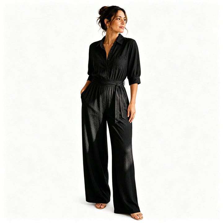 Elegant beige jumpsuit för dam med markerad midja och långa byxor