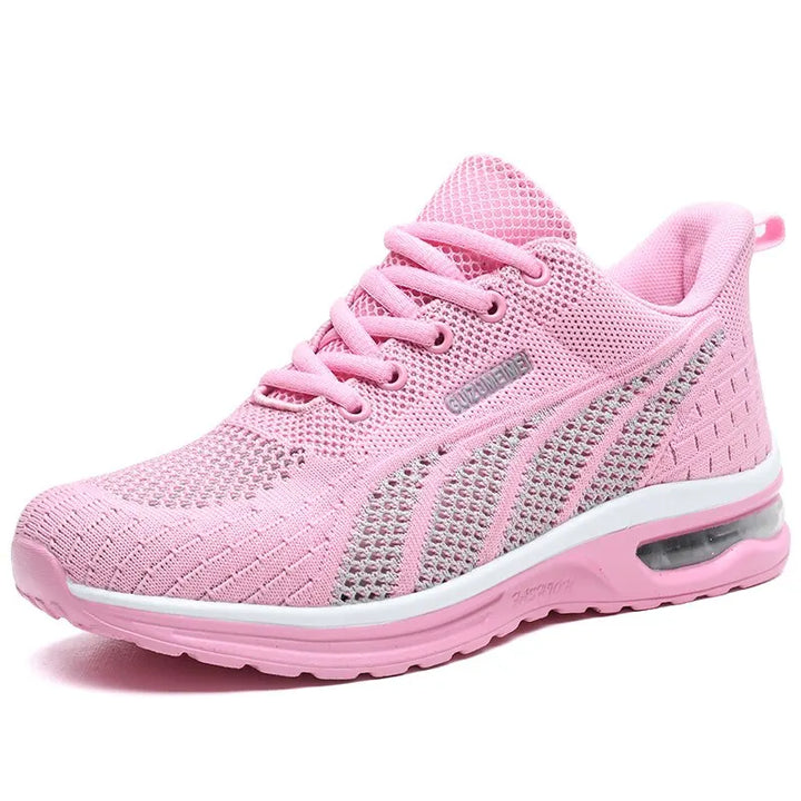 Andningsbar damsneaker i rosa med lätt vaddering och snörning, håller fötterna svala och bekväma.