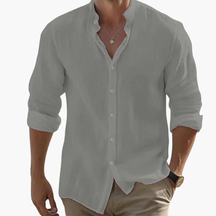 Mångsidig enfärgad herrskjorta med ståkrage och långa ärmar. Passar både vardag och fest, elegant herrmode.