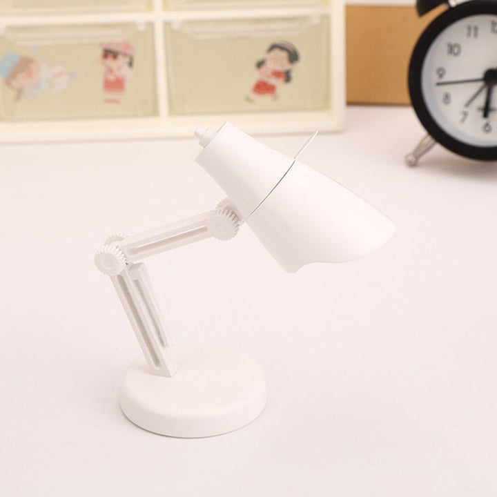 "Stilren magnetisk mini skrivbordslampa i flera färger med justerbar vinkel och bärbar kompakt design."