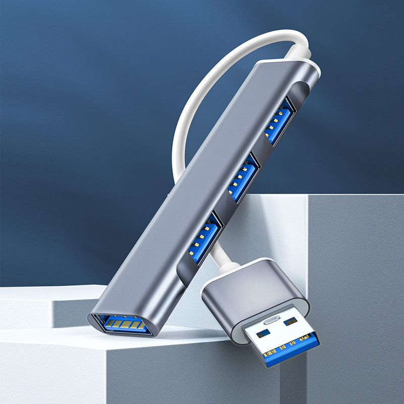 "Stilren USB Typ C HUB i silver med 4 portar för snabb anslutning och höghastighetsöverföring, kompakt och användarvänlig."