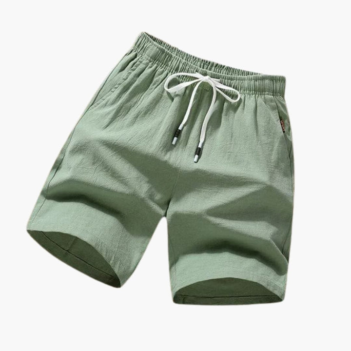 Stilrena herrbadshorts med justerbar dragsko och fickor, perfekta för strand & pool. Optimal komfort.