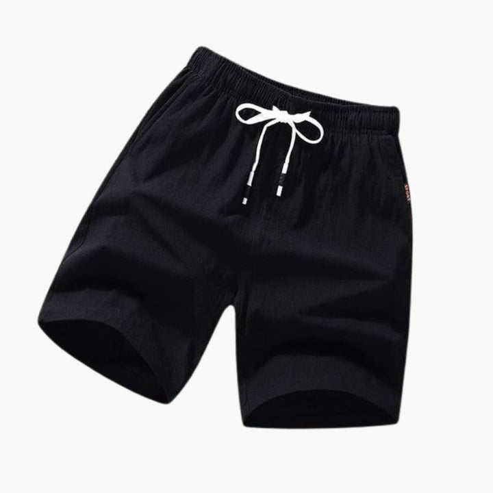 Trendiga herrbadbyxor, knälånga med dragsko, idealiska som strandshorts för sommarens aktiviteter.