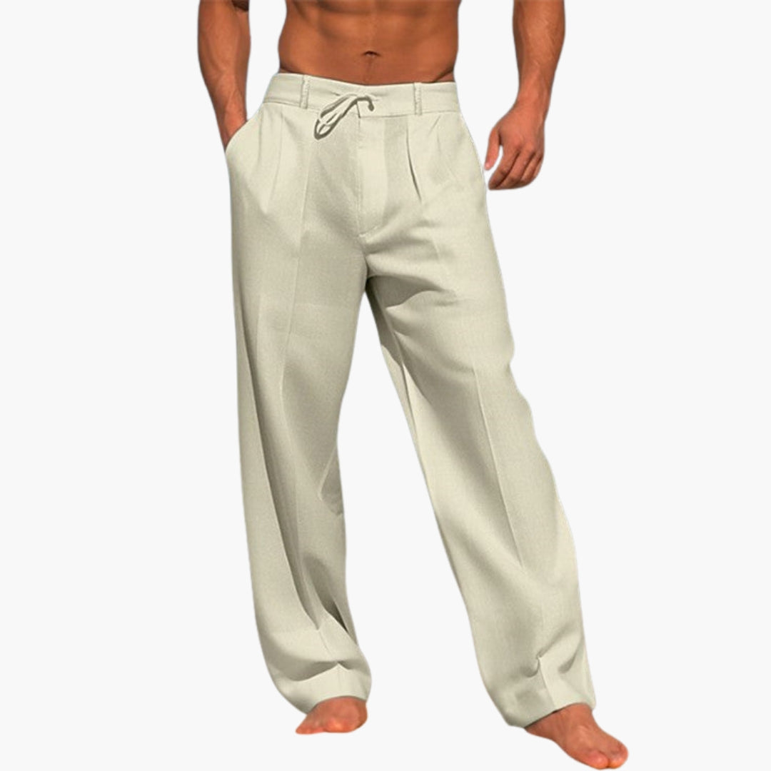 Man i bekväma, avslappnade herrbyxor med vid ben och elastisk midja, perfekta för casual stil.