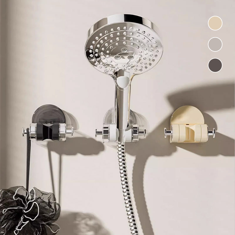 "Sugkopp duschtillbehör i silver och transparent ABS-material, justerbar krok för duschmunstycke, stilren badrumsdesign."