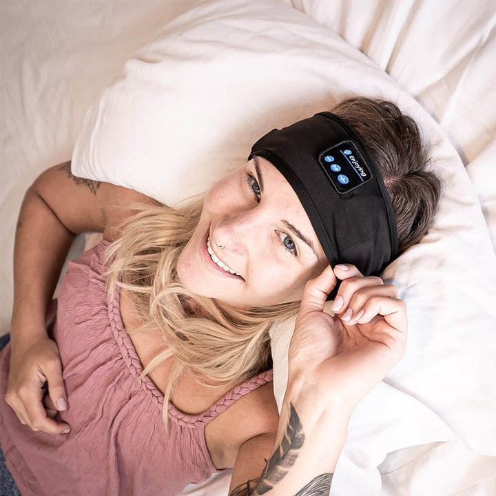 "Svart Bluetooth sportpannband med inbyggd mikrofon, trådlös teknik och flexibel passform för träning och avkoppling."