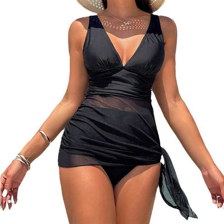 Klassisk svart tankini för dam med elegant omslag, mångsidiga badkläder för en sofistikerad strandlook.