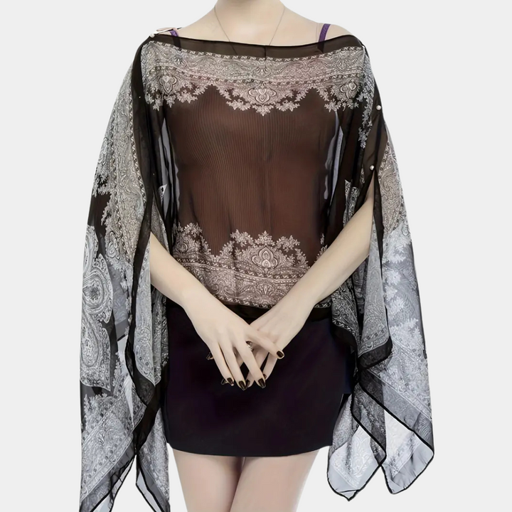 Elegant svart poncho-sjal Mira för dam, perfekt höstmode. Varm och stilfull vinteraccessoar i one size.