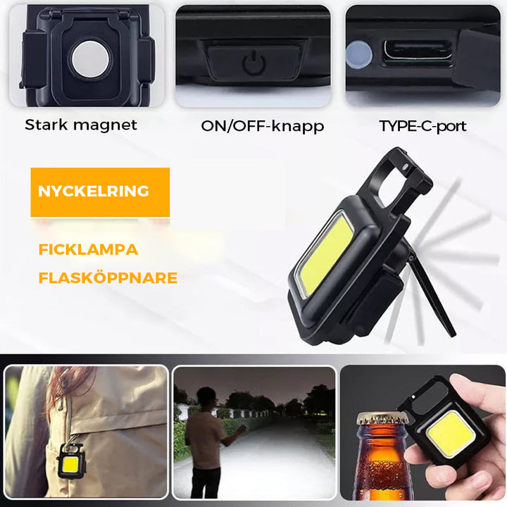 "Svart multifunktionell nyckelring nödljus med kompakt design och 4 ljuslägen, perfekt för utomhusaktiviteter."