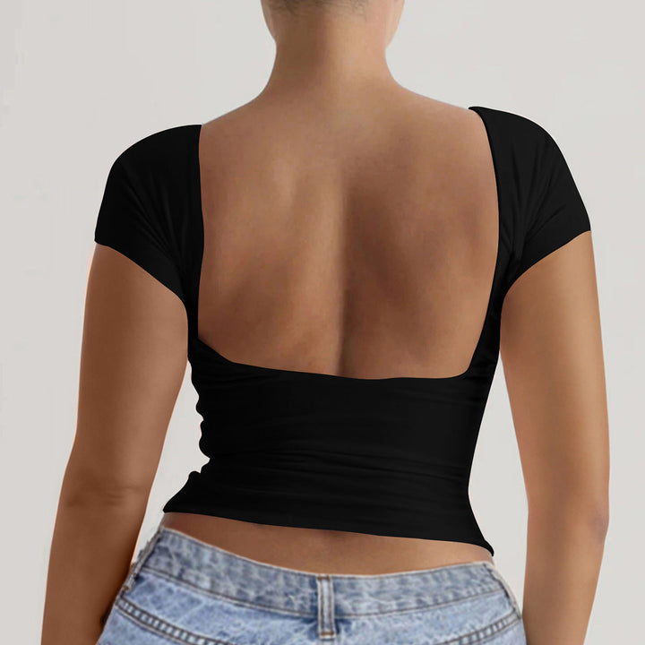 Svart off-shoulder damtopp med elegant design och djup rygg. Perfekt som festtopp eller stilfull vardag.