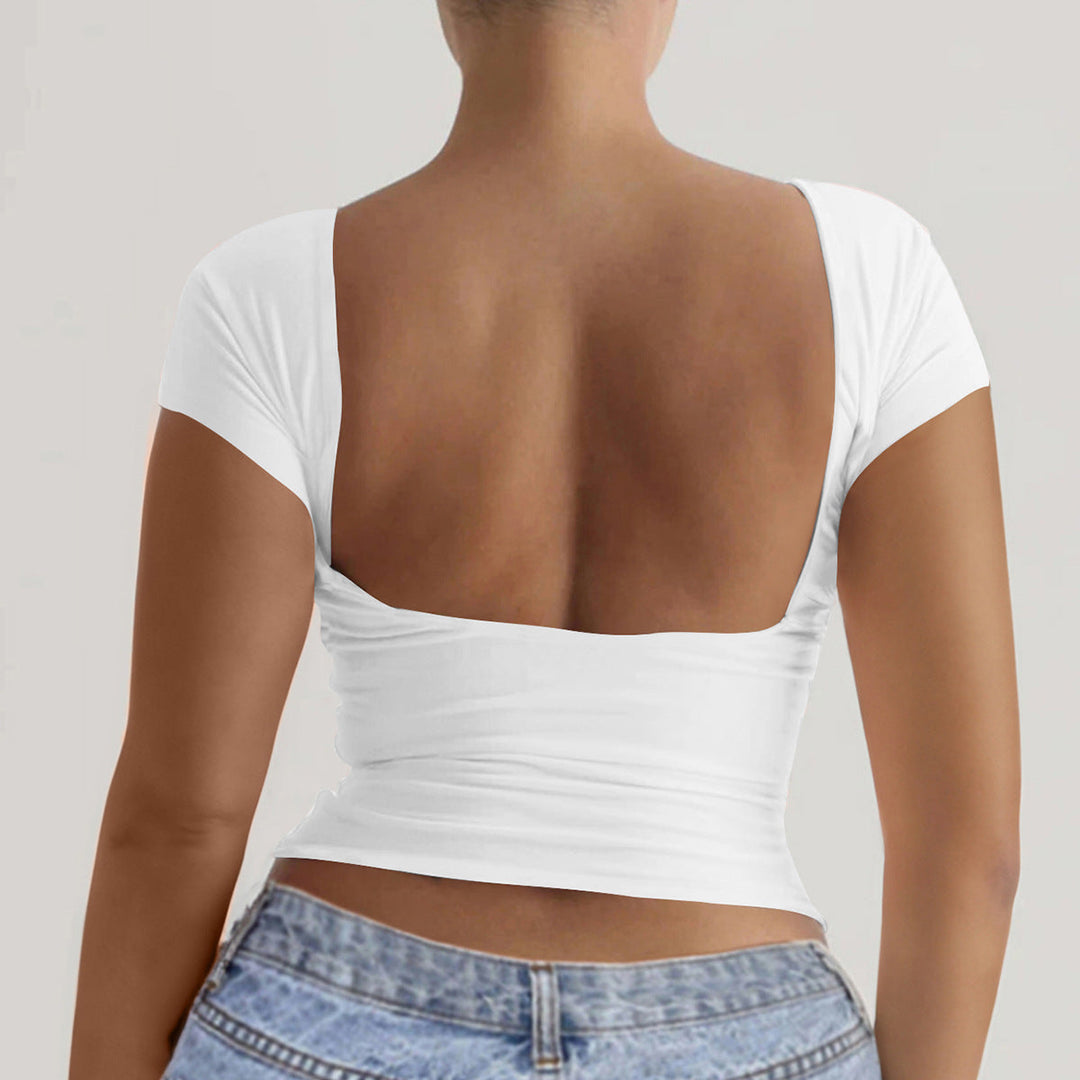 Elegant off-shoulder damtopp med djup rygg. Mångsidig vardagstopp eller festtopp i svart mode.