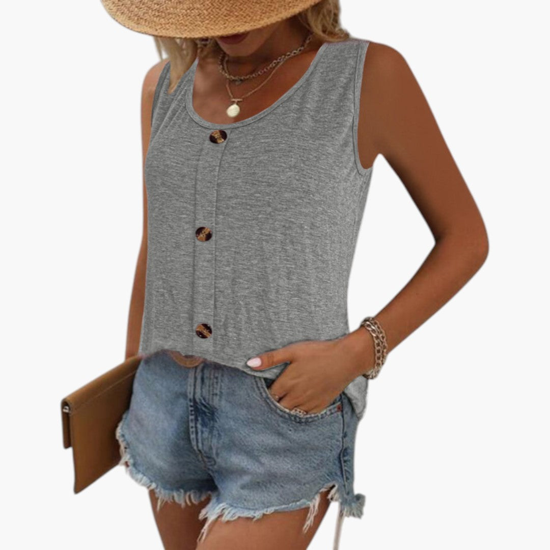 Elegant ärmlös damtopp i sommarpush-stil med rund hals och knappar fram, idealisk för lediga och fashionabla dagar.