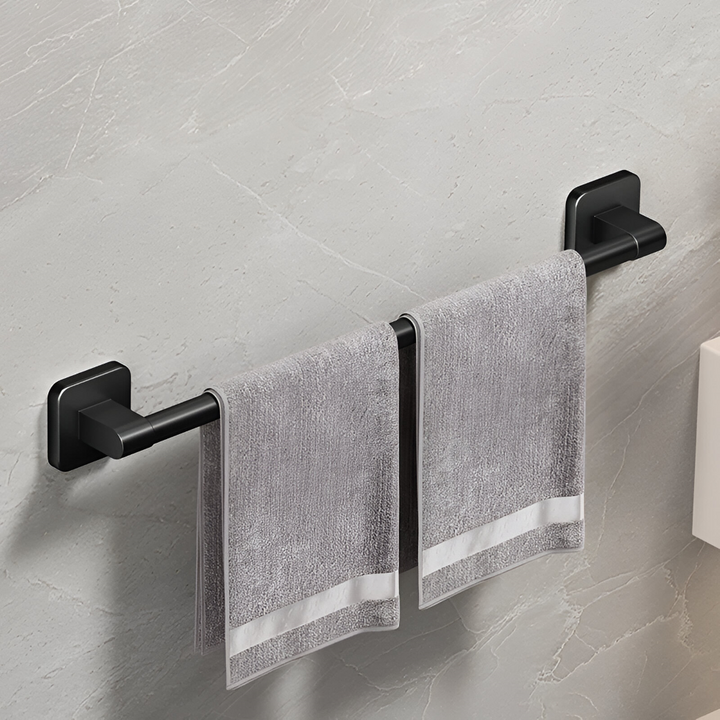Badrumstillbehör: Självhäftande svart handdukshållare i aluminium. Modern design.